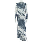 Long-sleeve, floor-length sheer mesh dress in a navy and white abstract brushstroke print with a slim, straight fit.