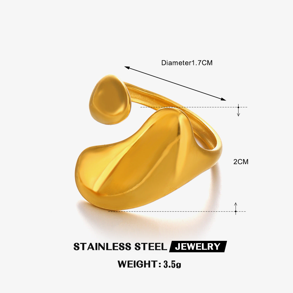 Gold-tone stainless steel open-style ring with an abstract, organic shape, shown with dimensions and weight specs.
