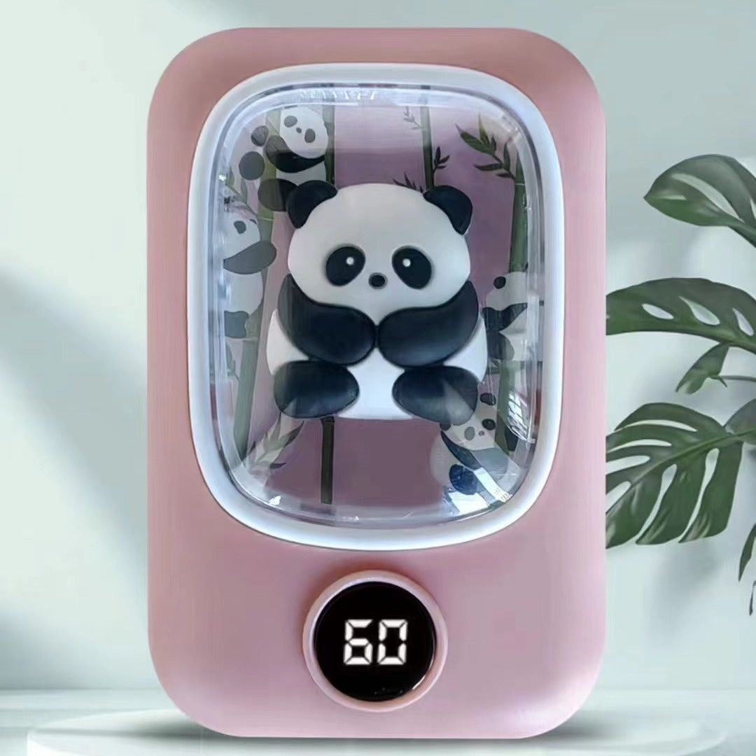 Pink rechargeable hand warmer featuring a 3D panda inside a clear dome and a digital temperature display showing 60.