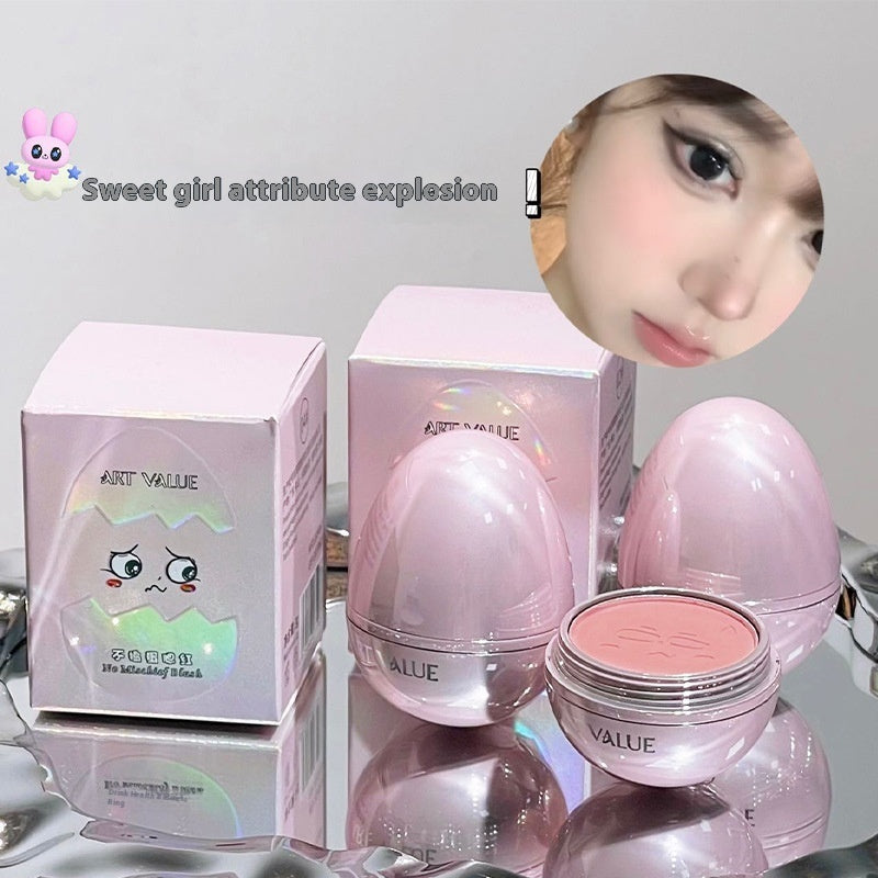Digitaldistribution375 pink egg-shaped cosmetic blush with a creamy matte finish in matching iridescent packaging.