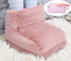 Plush, pink faux-fur electric foot warmer. Includes an inset showing the detachable heating unit for charging.