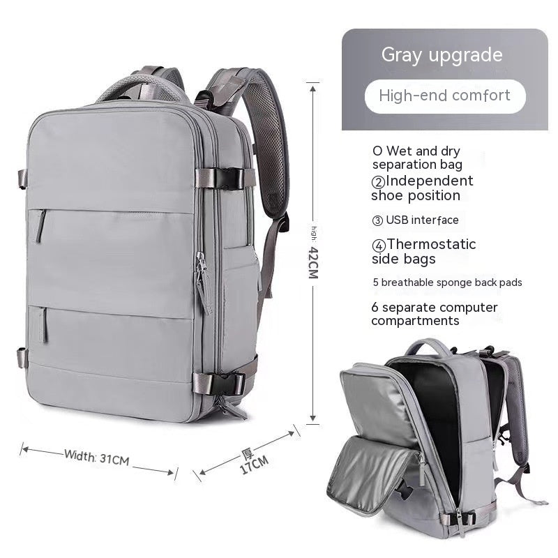 Gray waterproof travel backpack with multiple compartments, USB port, shoe storage, and mesh padded straps.