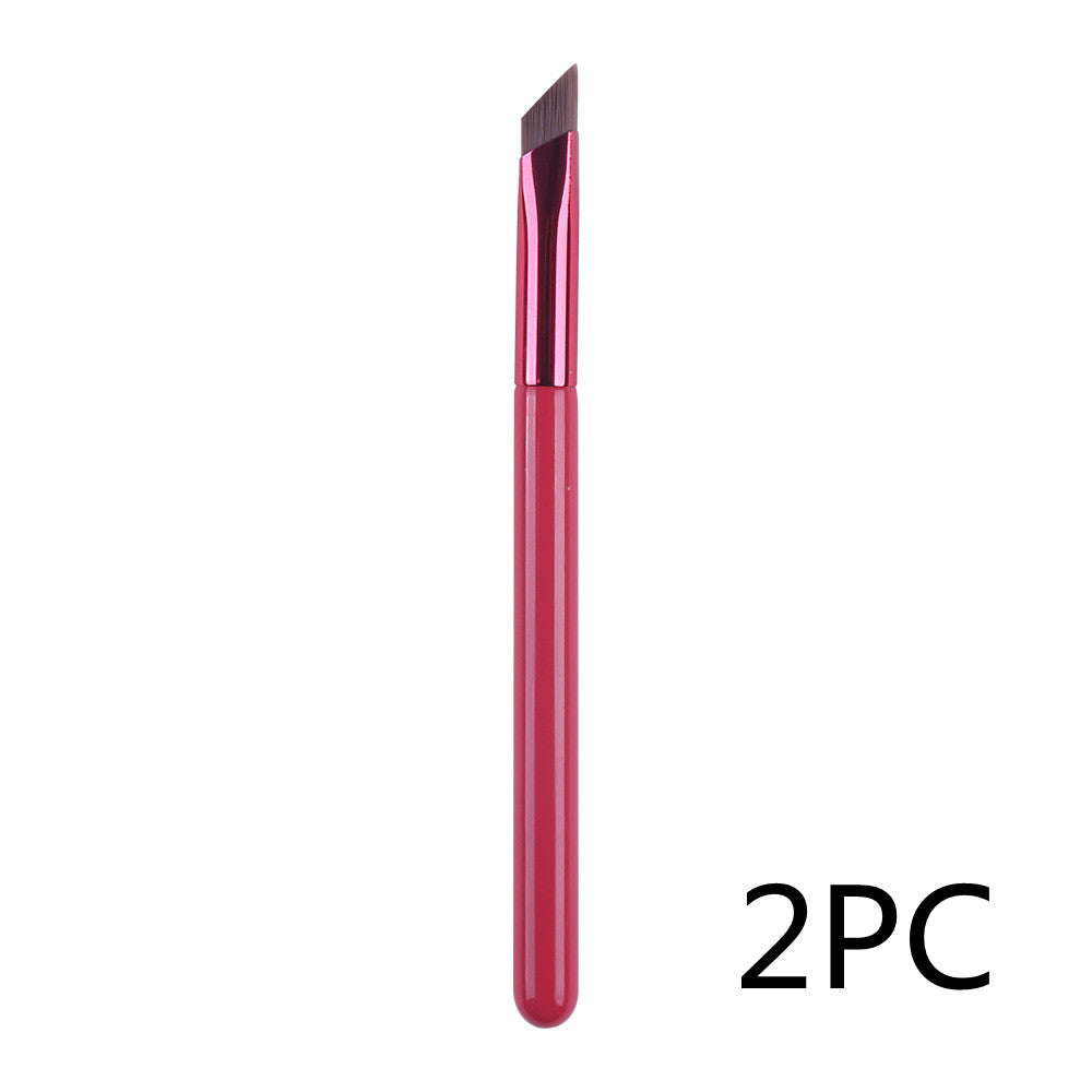 A 2-piece set of thin, angled eyebrow brushes featuring a metallic red handle and dark brown synthetic bristles.