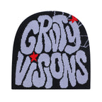 Black knit beanie featuring oversized purple graffiti text, red star accents, and spiderweb detailing.