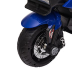 Close-up of a blue kids' electric motorcycle front wheel with black treaded tire, chrome-look disc, and xRt decal.