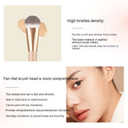 Soft flat makeup brush with gold ferrule, dense bristles, and text describing its streak-free, seamless application.