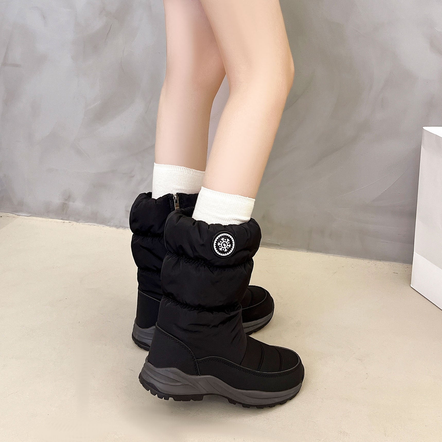 Digitaldistribution375 black, mid-calf, thickened cotton snow boots with a zippered side and snowflake emblem.