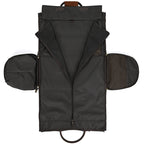 Unfolded black fabric garment bag with leather accents, featuring zippered side compartments and a central zipper.