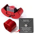 Red heart-shaped jewelry box with an eternal rose in a clear case, plus a necklace in a gift box with a love note.