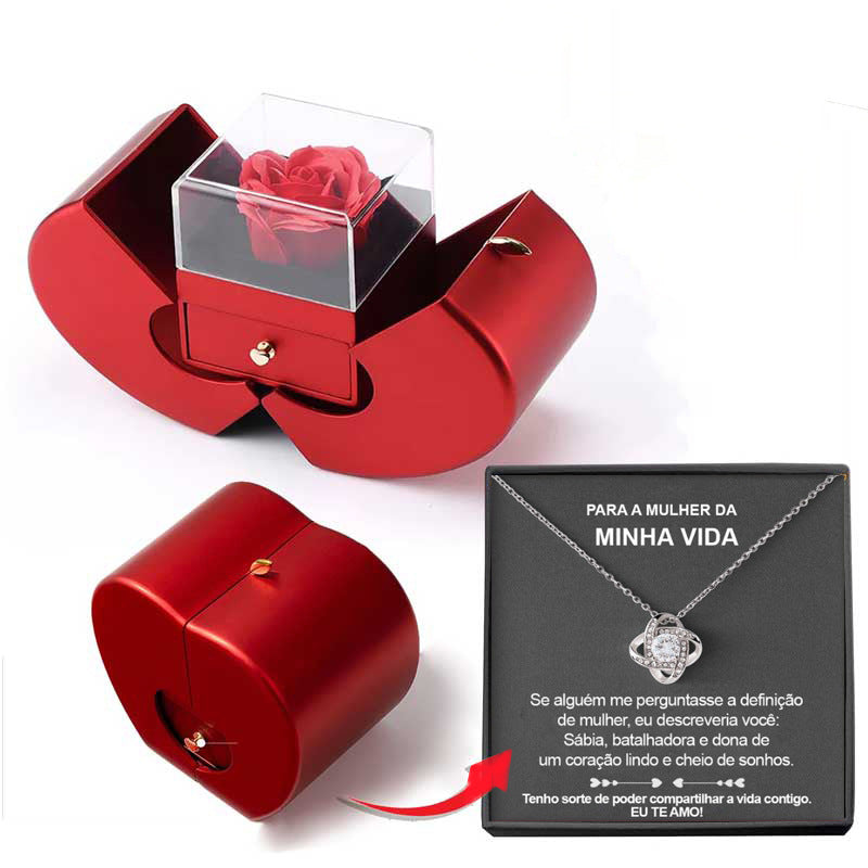 Red heart-shaped jewelry box with an eternal rose in a clear case, plus a necklace in a gift box with a love note.