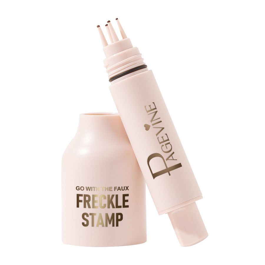 Light pink 5-point freckle stamp pen with gold branding and a custom applicator tip for creating faux freckles.