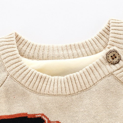 Beige knit newborn sweater featuring a ribbed collar, wood-look button detail, and soft fleece lining.