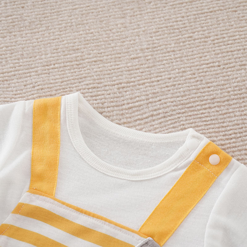 Baby girl's white jumpsuit featuring yellow straps, a striped bodice, and convenient shoulder snap closures.