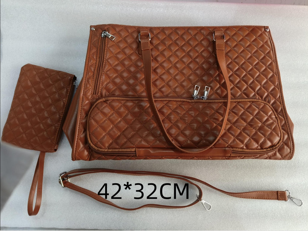 Brown quilted large lunch tote with matching wristlet, zippered pockets, dual carry handles, and adjustable strap.