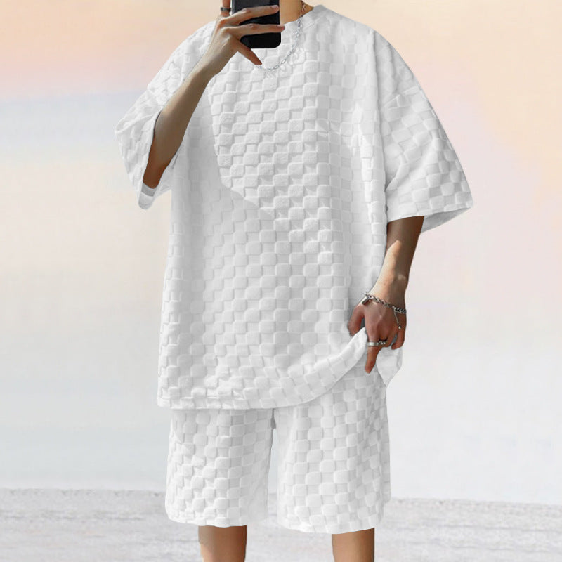 White jacquard plaid matching shorts set in loose, textured fabric with a short-sleeve tee and straight-fit shorts.