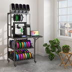 Black metal 3D printer stand on wheels with two lower filament storage shelves, a workbench, and top supply rack.