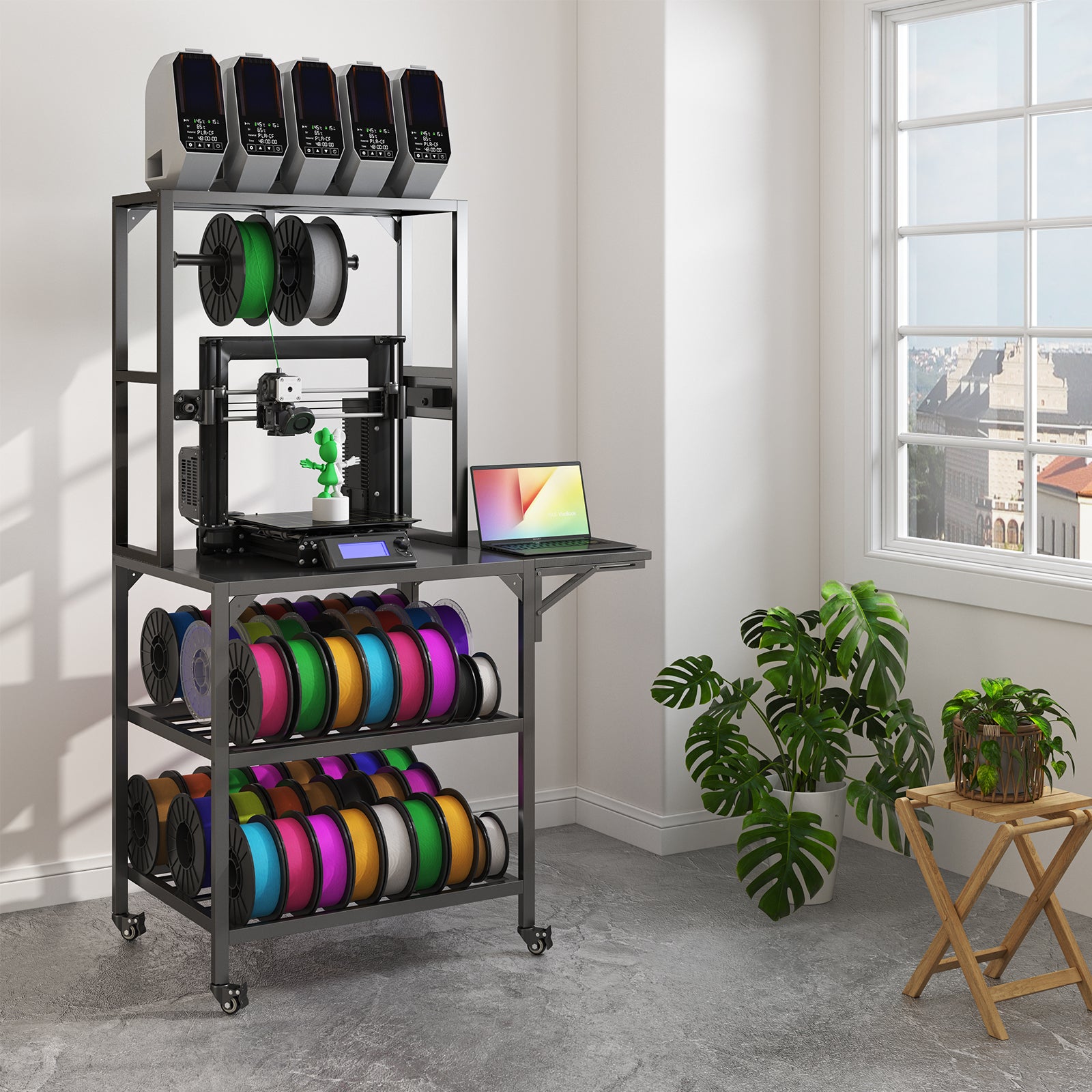 Black metal 3D printer stand on wheels with two lower storage shelves, a filament spool rack, and top printer mounts.