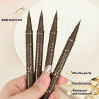A hand holds four slim brown eyeliner pens with gold lettering, featuring ultra-fine tips for precise application.