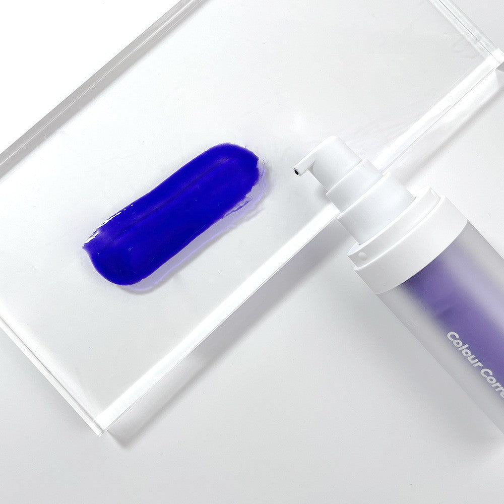 A purple V34 whitening mousse bottle and a swatch of deep purple toothpaste on a transparent acrylic surface.