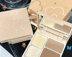 Beige 4-well contour and highlight palette with floral embossed powders, mirror, and cloud-patterned packaging.