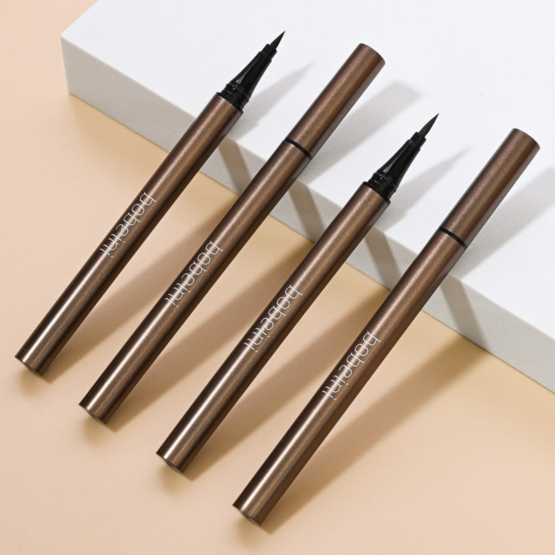 Four metallic brown waterproof liquid eyeliner pens by bobeini arranged on a white and beige surface.