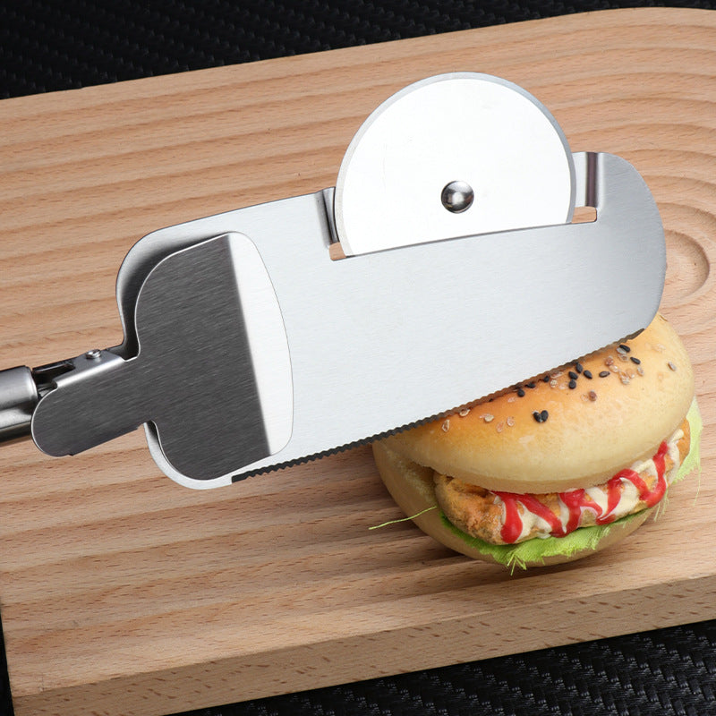 Stainless steel 3-in-1 pizza cutter with circular blade and integrated spatula, resting on a wooden cutting board.