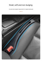 Black leather car seat gap storage organizer, slim design fits flush next to a gray leather car seat.