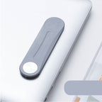 Gray aluminum alloy side-screen phone bracket attached to a laptop, featuring a sleek, minimalist magnetic design.