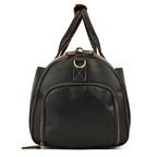 Dark brown vintage leather duffle bag with sturdy handles, side zippers, and brass hardware against a white background.