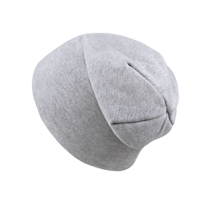 A soft, light-gray cotton jersey newborn beanie hat with a simple, relaxed, rounded silhouette on a white background.
