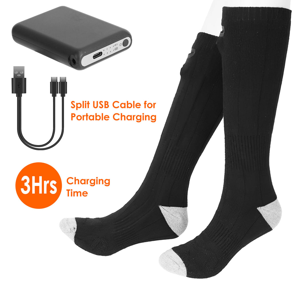 Pair of black heated socks with grey toes, including a portable battery and split USB charging cable.