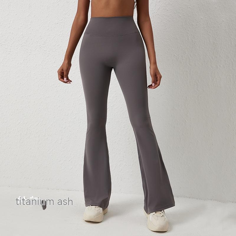Titanium ash high-waisted, hip-lifting flared fitness pants made of smooth, stretchy athletic fabric.