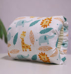 Adjustable cotton nursing arm pillow with a white fabric featuring a colorful animal and leaf pattern.