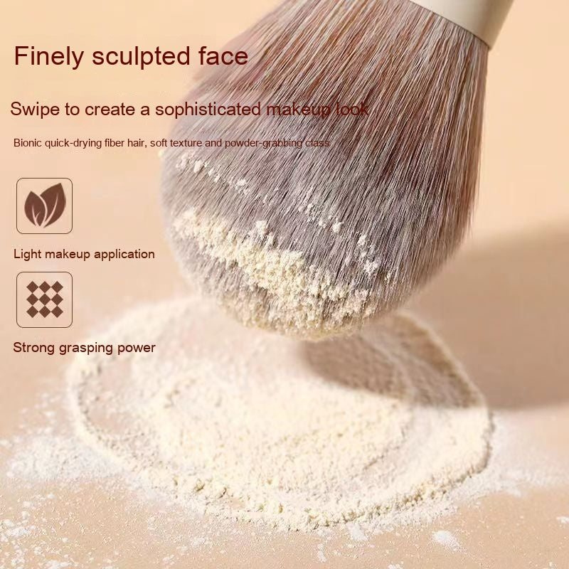 Soft, beige-toned makeup brush with dense bionic fibers picking up fine powder, featured in a sleek marketing graphic.