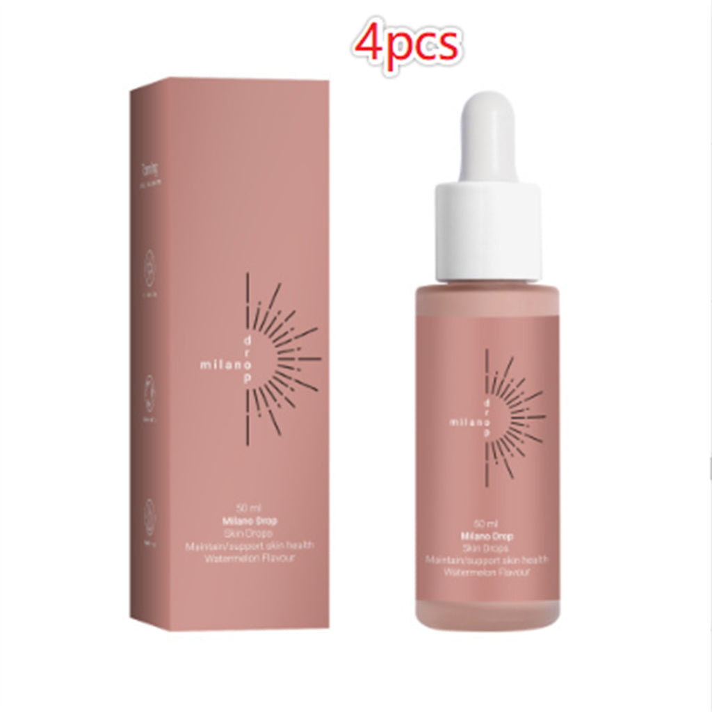 Milano Drop tanning serum in a dusty pink bottle and matching box with white dropper cap. 4-piece set packaging.