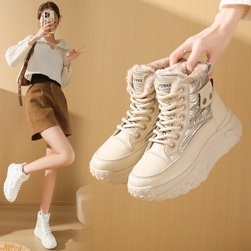 Beige fleece-lined high-top boots with quilted panels, thick platform soles, and lace-up fronts.