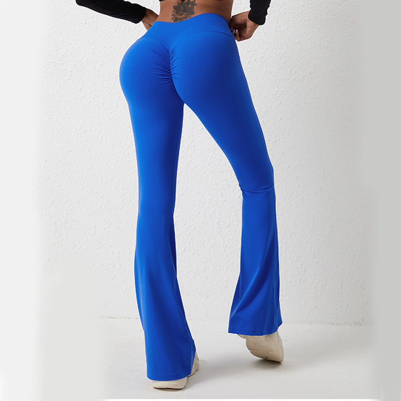 Royal blue high-waisted fitness pants with flared legs and a ruched back design for a lifting effect.