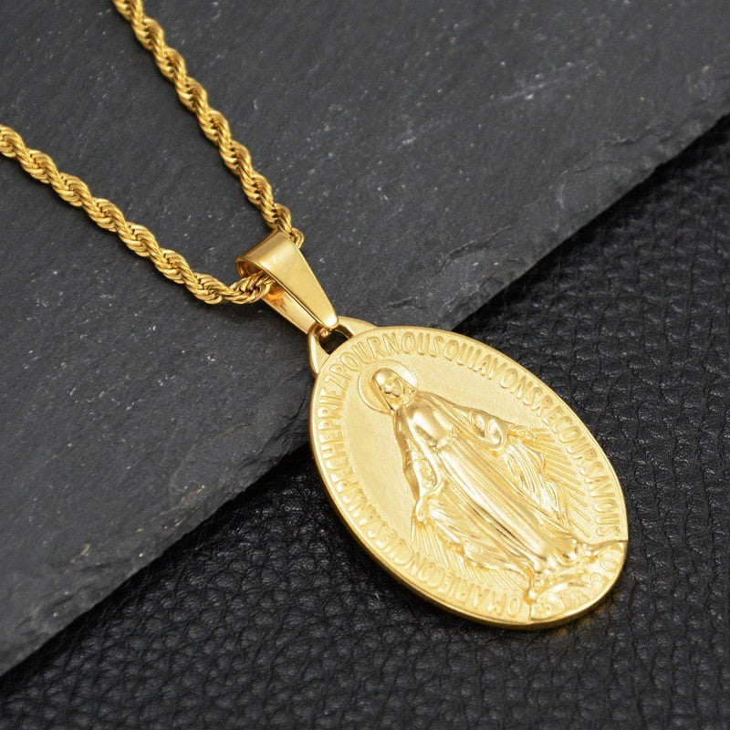 Gold-tone titanium steel necklace with a Virgin Mary oval pendant and rope chain on a black textured background.