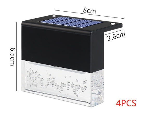 Black solar fence light with clear bubble-effect base and blue solar panel, labeled with dimensions in centimeters.