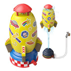 Yellow, space-themed rocket water sprinkler toy for gardens, connecting to a hose to spray water while hovering.