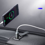 Black leather business backpack with a built-in USB charging port connecting to a smartphone.