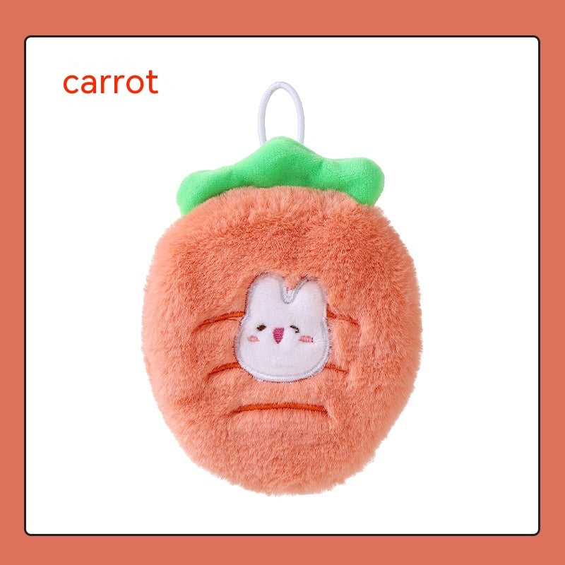Soft, fuzzy orange plush hand warmer shaped like a carrot with a green top, white hanging loop, and cute bunny face.