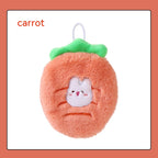 Soft, fuzzy orange plush hand warmer shaped like a carrot with a green top, white hanging loop, and cute bunny face.