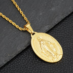 Gold titanium steel rope chain necklace with an oval Miraculous Medal pendant featuring a religious relief design.