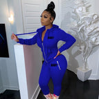 Model in a royal blue, form-fitting zippered hoodie and matching joggers, both featuring "BODY" text print.