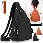 Black and orange waterproof nylon sling chest backpacks with multiple pockets, adjustable straps, and zipper closures.