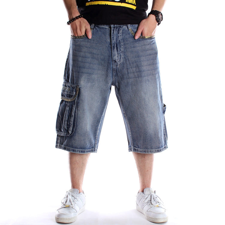 Blue denim hip-hop cargo shorts with multiple pockets, loose fit, and camouflage pocket detailing.