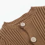 Brown ribbed knit baby bodysuit featuring a crew neckline and two large, light-colored wooden buttons.