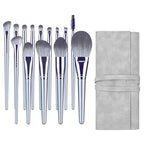 A set of grey makeup brushes with soft bristles, metallic handles, and a matching grey roll-up storage pouch.