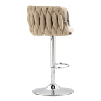 Beige fabric swivel bar stool with a woven back design on a chrome pedestal base with a footrest.